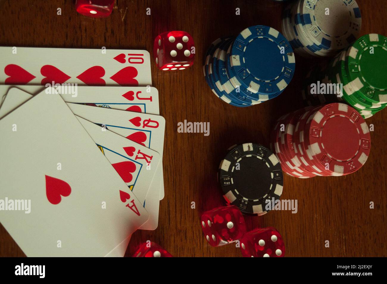 Create an artistic representation of a royal flush, the highest-ranking  hand in poker, using vibrant colors and intricate details. showcase the  five cards (ace, king, queen, jack, and ten) from a single