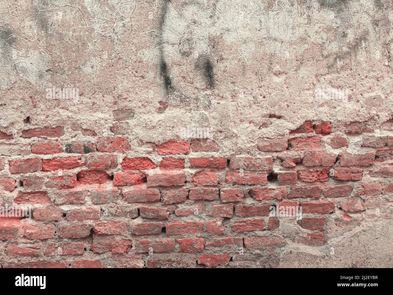red brick block wall texture old background ancient weathered brick wall with cracks and destroyed stucco layer with copy space Stock Photo