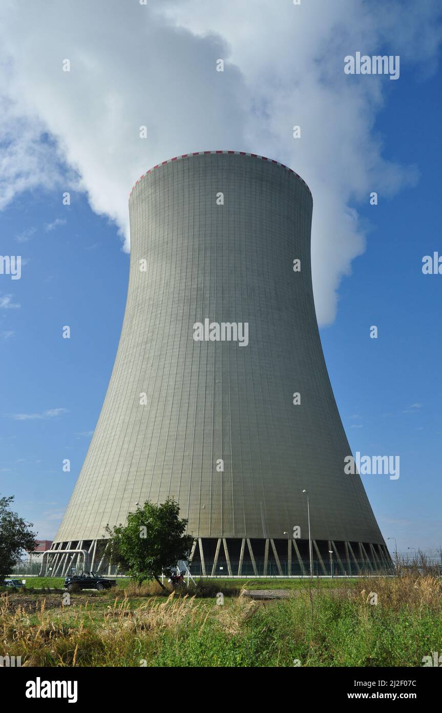 A vertical shot of Temelin nuclear power plant with blue sky above ...