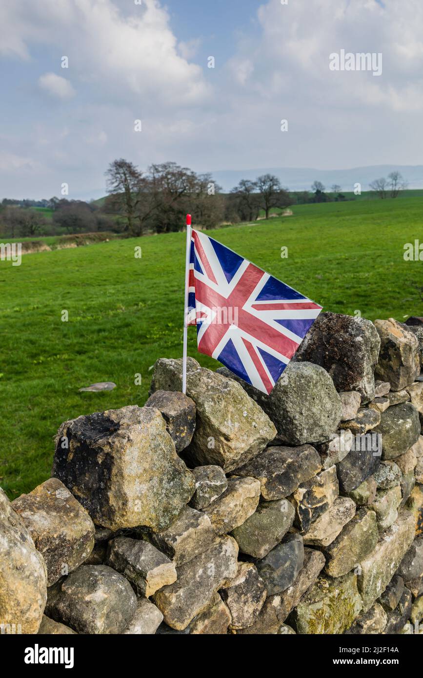 Union Jack flag on drystone wall, Longridge Fell, Lancashire, UK. Stock Photo