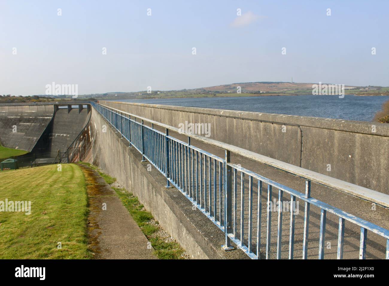 The walkway across the concrete dam at Stithians Reservoir Cornwall England UK. Stock Photo