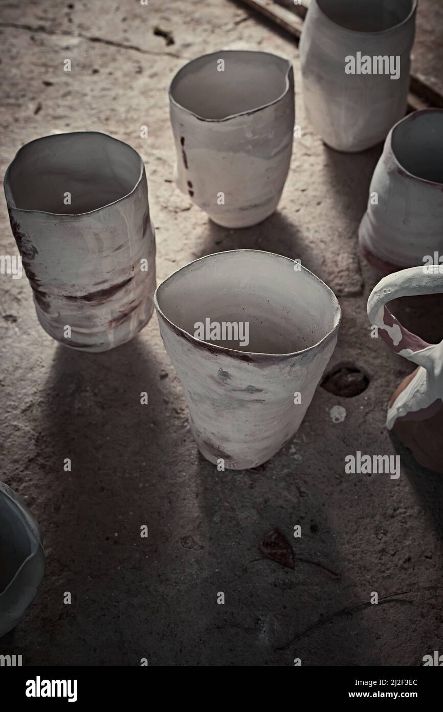 handmade ceramics, empty craft ceramic cup on gray background Stock Photo