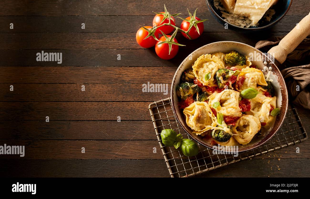 The delicious Italian tortelloni stewed with broccoli and tomatoes and