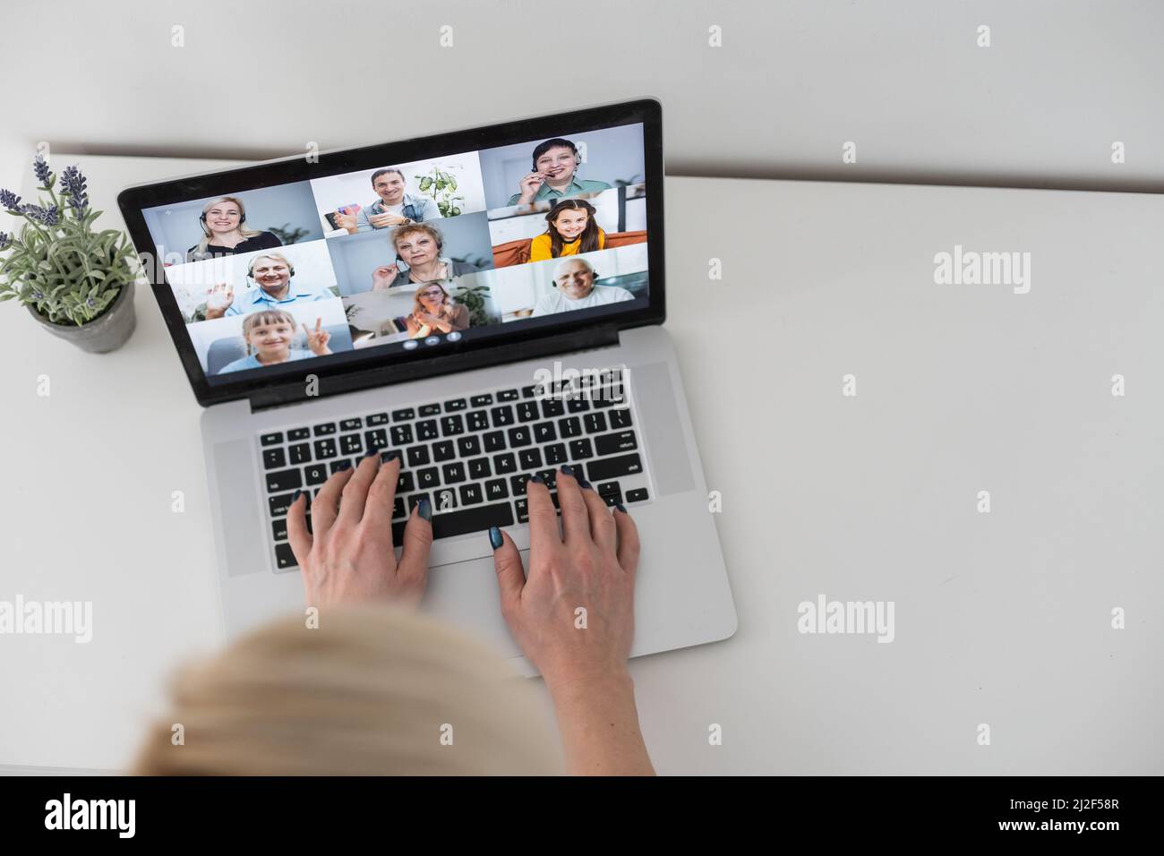 Caucasian female teacher using computer and laptop on video call with ...