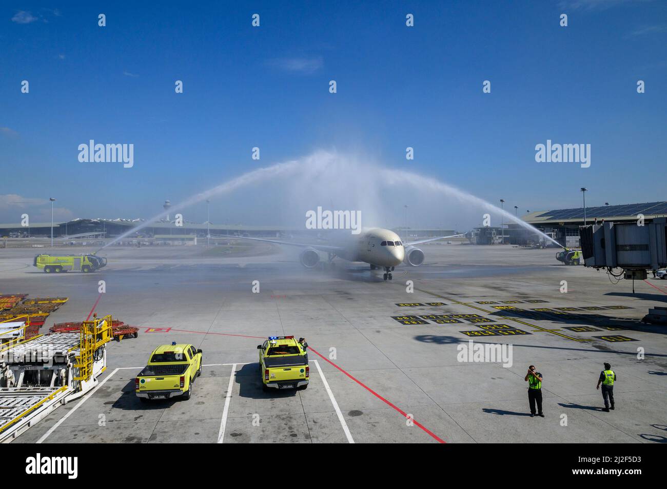 Kuala Lumpur, Malaysia. 1st Apr, 2022. A passenger plane is welcomed by water cannon salute at the Kuala Lumpur International Airport in Sepang of Selangor, Malaysia, April 1, 2022. Malaysia opened its borders to international travel on Friday, ending restrictions that have been in place since the COVID-19 pandemic began in 2020. Credit: Chong Voon Chung/Xinhua/Alamy Live News Stock Photo