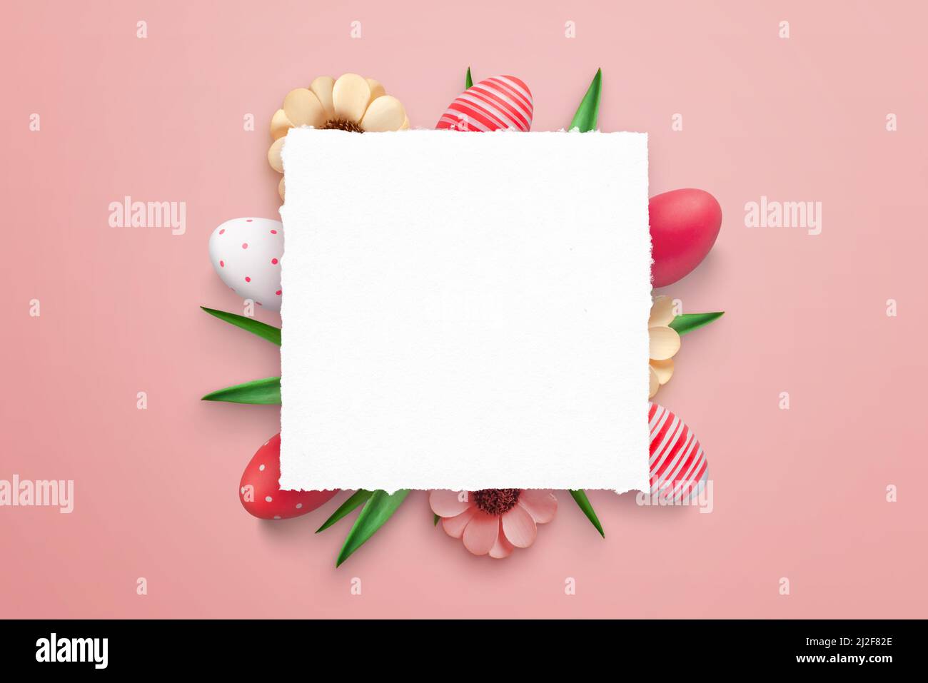 Blank paper surrounded with Easter eggs and decorations for promo greeting text Stock Photo