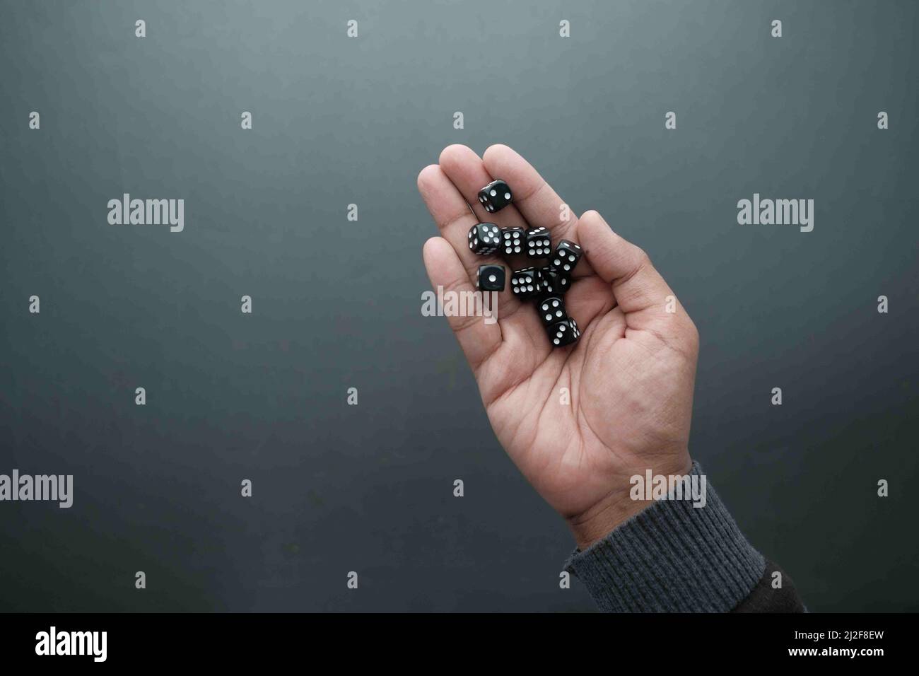 Black Dice trowing on black background top view  Stock Photo
