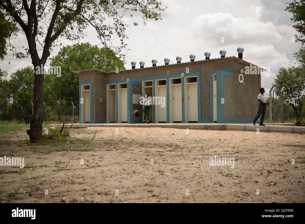 Students make use of new bathroom toilets - outdoor pit latrines - at a public primary school in  Oshana Region, Namibia, southern Africa. Stock Photo