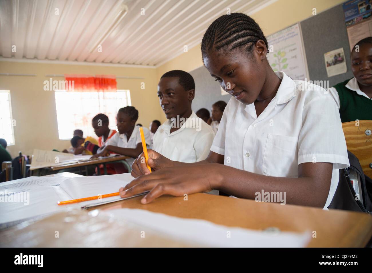 Secondary school students learning at desks in classroom in Oshana Region, Namibia, southern Africa. Stock Photo