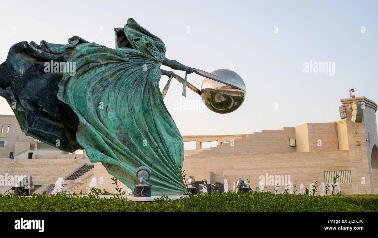 DOHA, QATAR - DECEMBER 30, 2021: The Force of Nature sculpture by Lorenzo Quinn in Katara Cultural Village in Doha Stock Photo