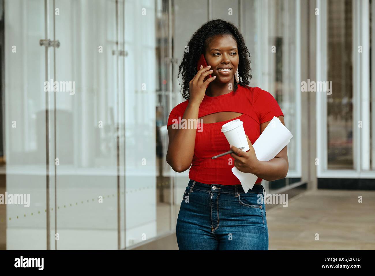 smiling black African American lady calling on phone businesswoman entrepreneur Stock Photo