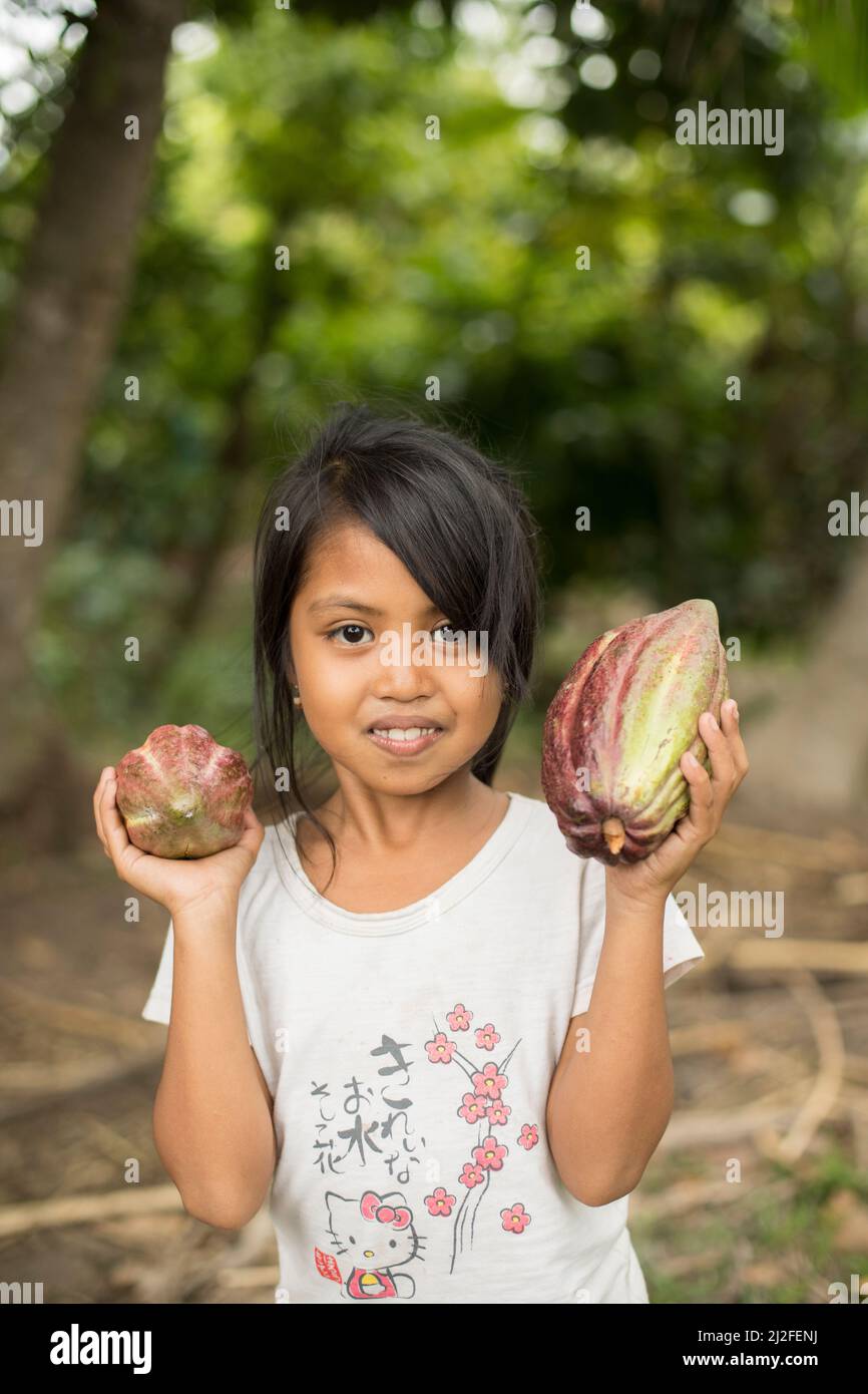 Ririn (7) is the daughter of a cocoa farmer in in Mamuju Regency, Indonesia, where MCC is helping to strengthen the cocoa value chain under the Indone Stock Photo