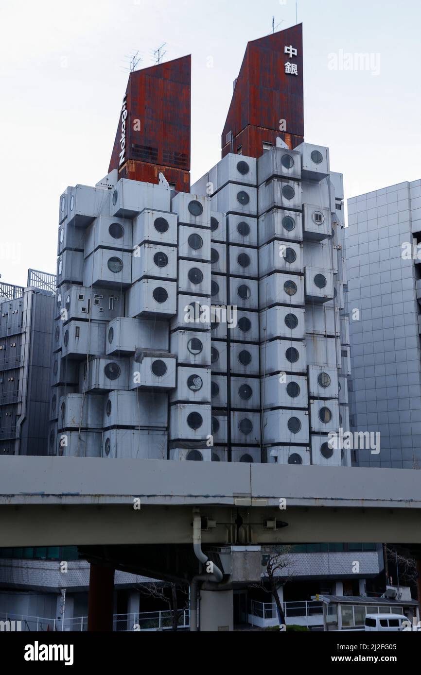 Tokyo, Japan. 1st Apr, 2022. The Nakagin Capsule Tower is seen in downtown  Tokyo. The futuristic building mixed-use residential and office tower  designed by architect Kisho Kurokawa consists of 144 individual capsules (