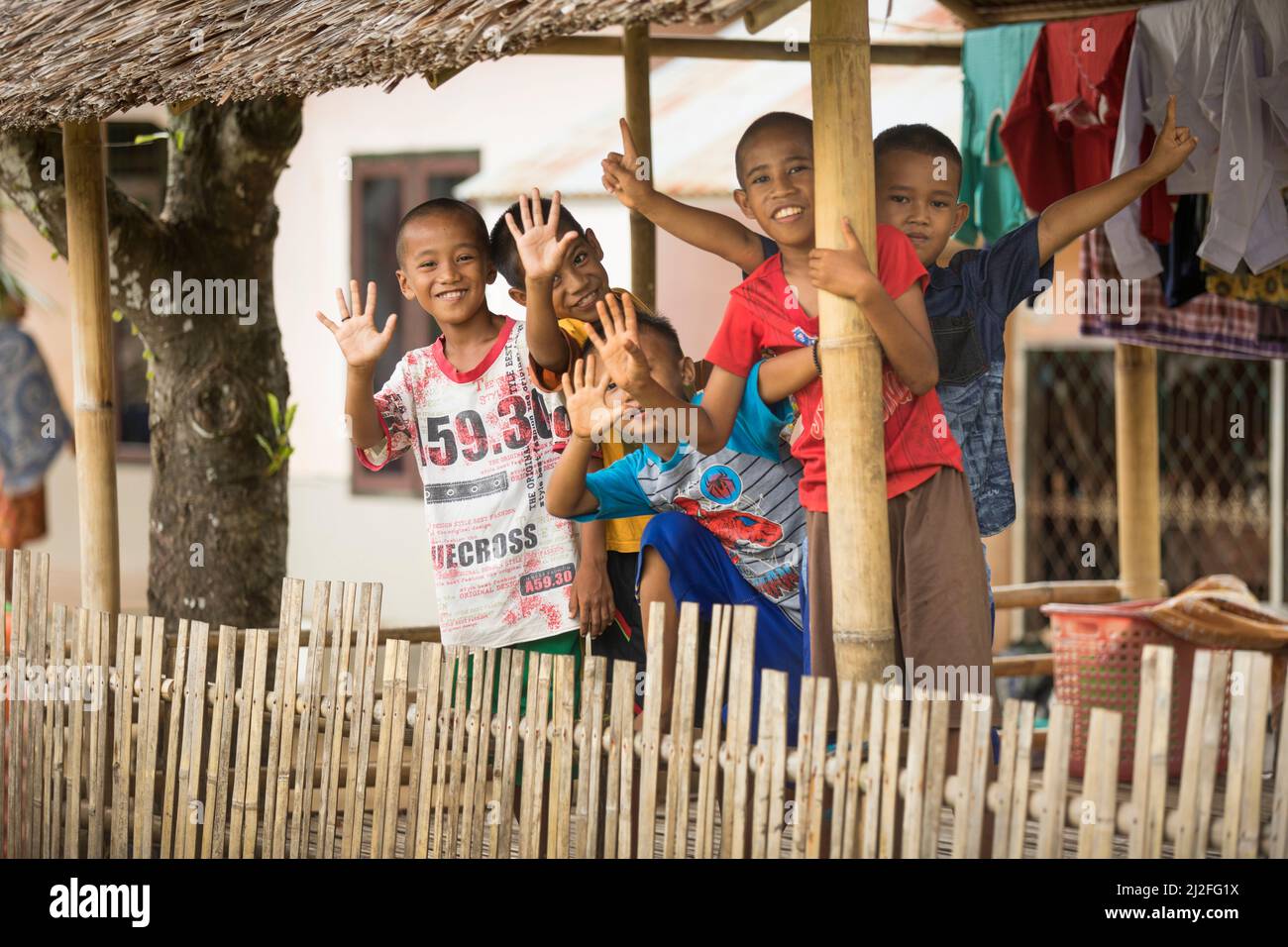 A group of children huddle together on Karampuang Island, Indonesia