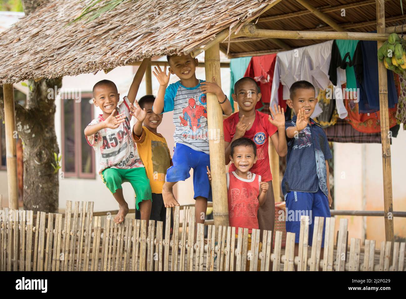 A group of children huddle together on Karampuang Island, Indonesia