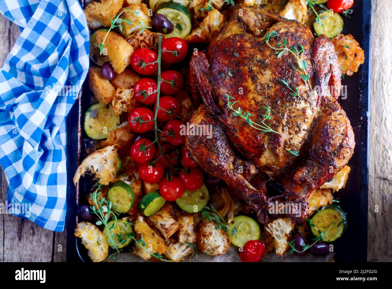 SUMAC ROAST CHICKEN WITH LEMON AND GARLIC..style rustic.selective focus