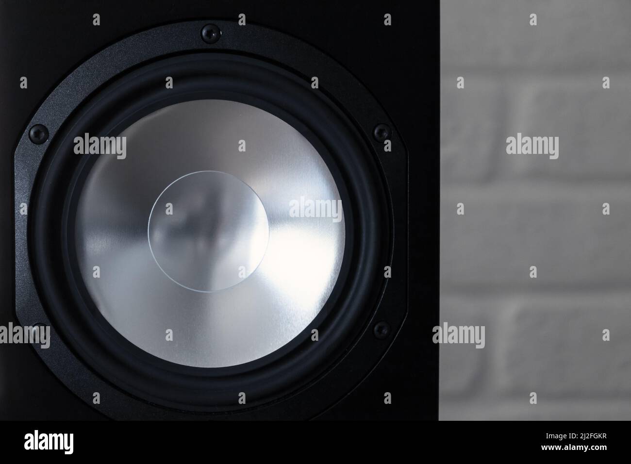 Shiny audio speaker in black body, close-up photo with selective soft focus Stock Photo