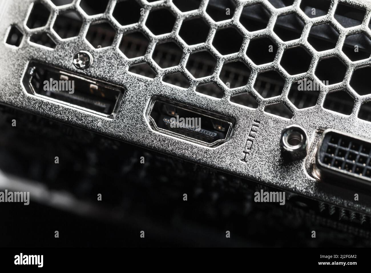 New shiny PC ventilation grille and digital video sockets, abstract close-up photo with selective focus Stock Photo
