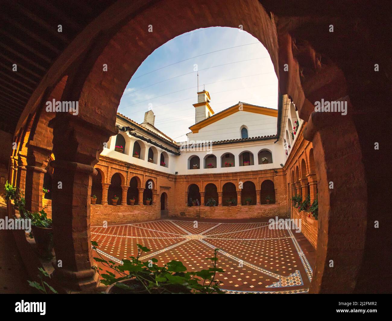 Cloister in the Mudejar architectural style of the Monastery of Santa María de la Rábida in Huelva. Stock Photo