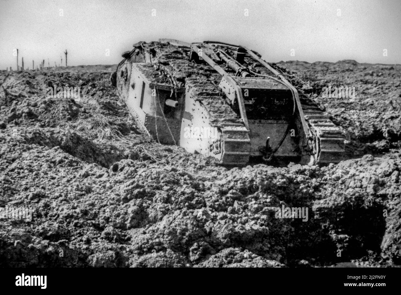 British WWI Mark IV male tank bogged down in the mud near Clapham Junction, Ypres during First World War One in West Flanders, Belgium Stock Photo
