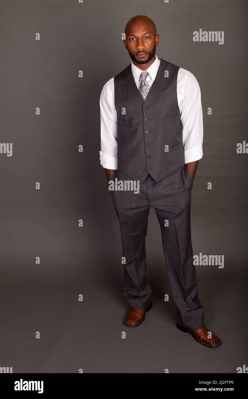 Young black business man wearing a suite and tie Stock Photo - Alamy