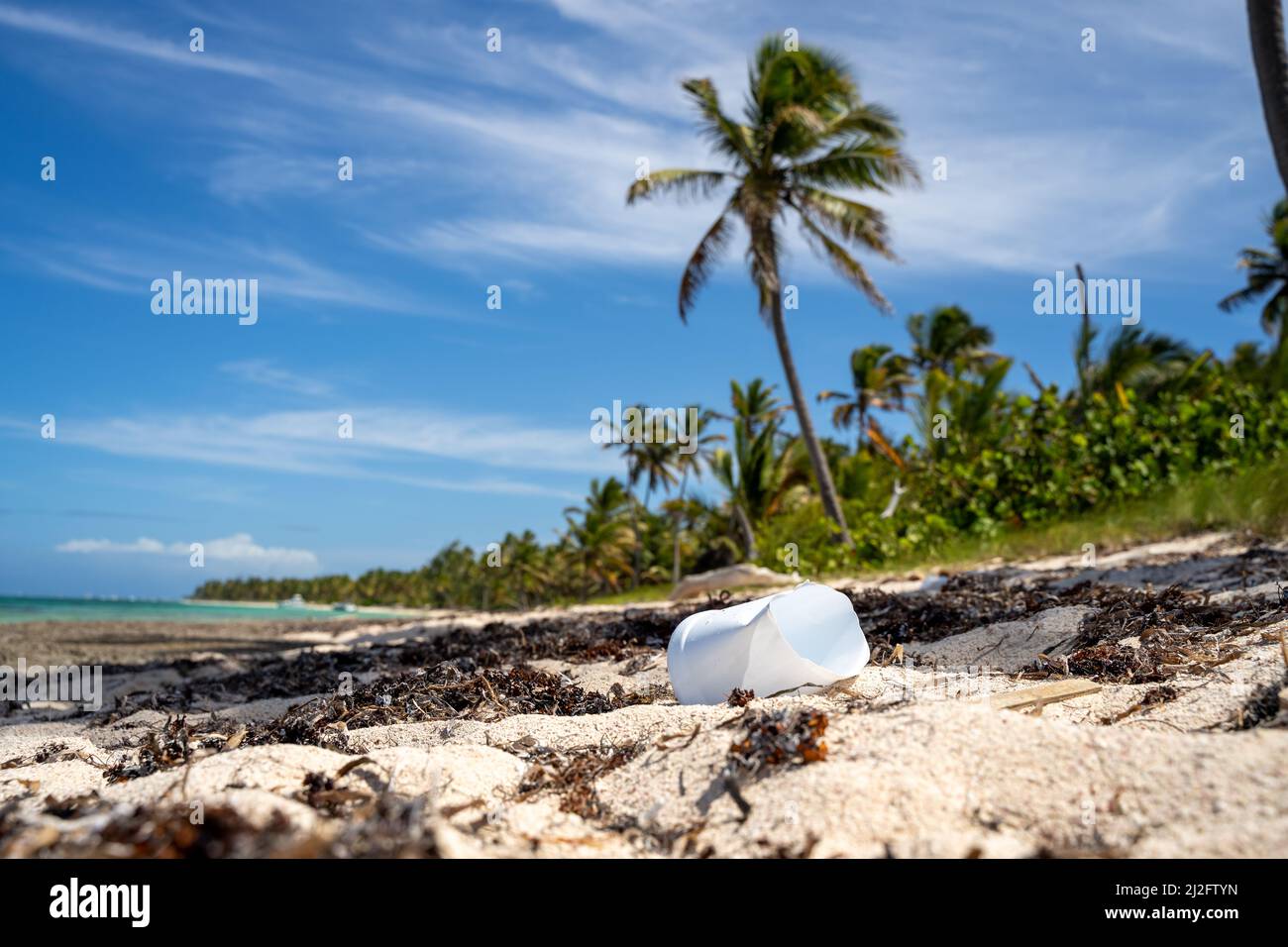 A view of plastic waste polluting the environment on the tropical beach in Punta Cana, Dominican