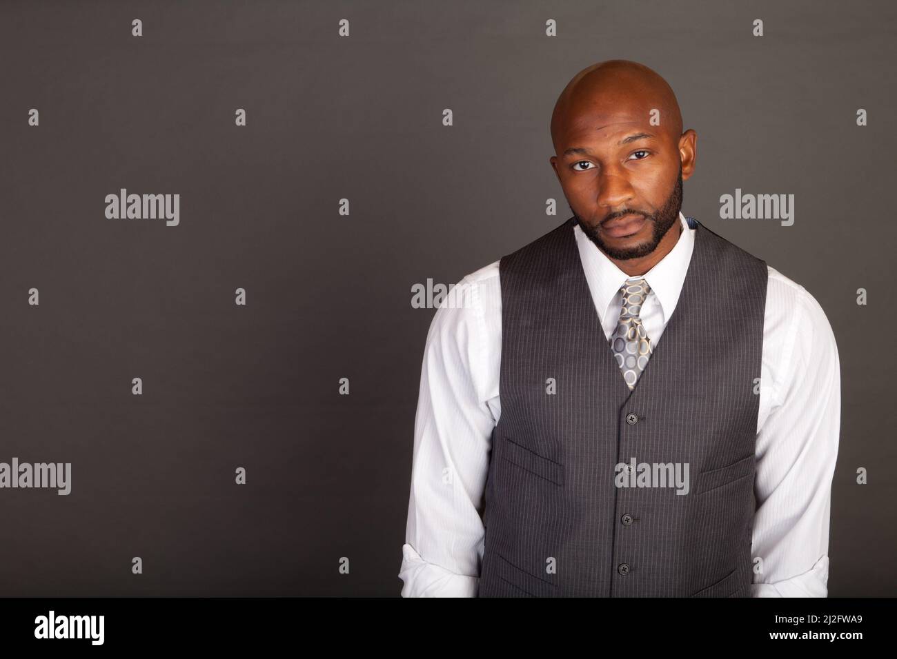 Young black business man wearing a suite and tie Stock Photo - Alamy