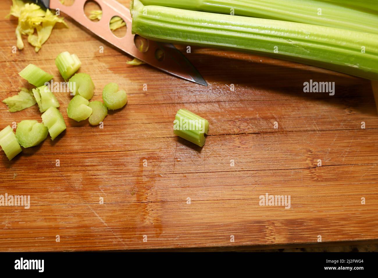 Fresh organic celery on a wooden cutting board Stock Photo