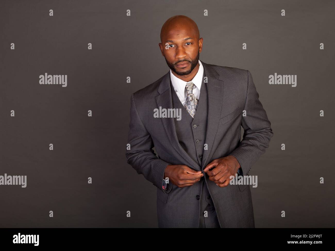 Young black business man wearing a suite and tie Stock Photo - Alamy