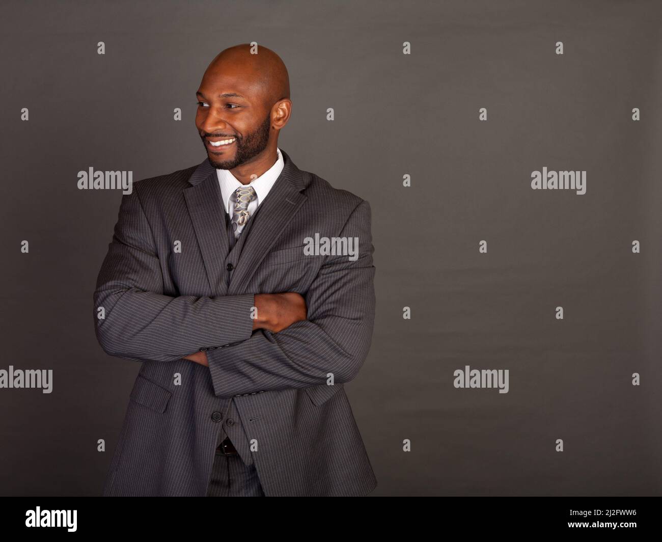 Young black business man wearing a suite and tie Stock Photo - Alamy