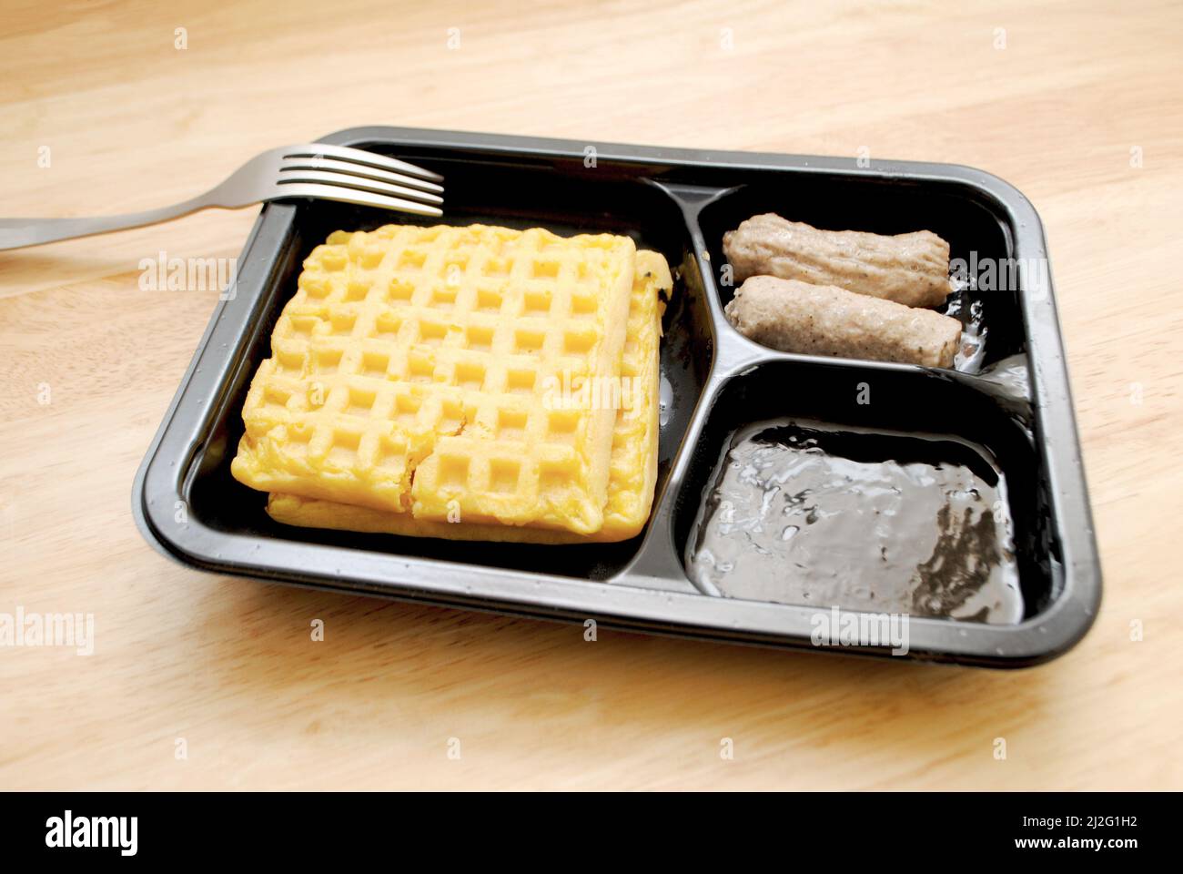 Two Square Waffles Served with Sausage Links Stock Photo