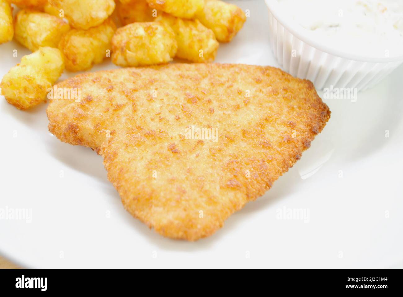 Breaded Haddock Fish as Part of a Quick Dinner Stock Photo