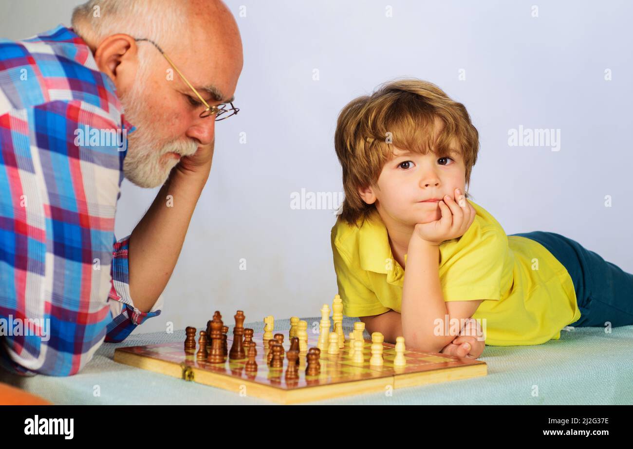 Teenager Playing Chess with his Grandfather · Free Stock Photo