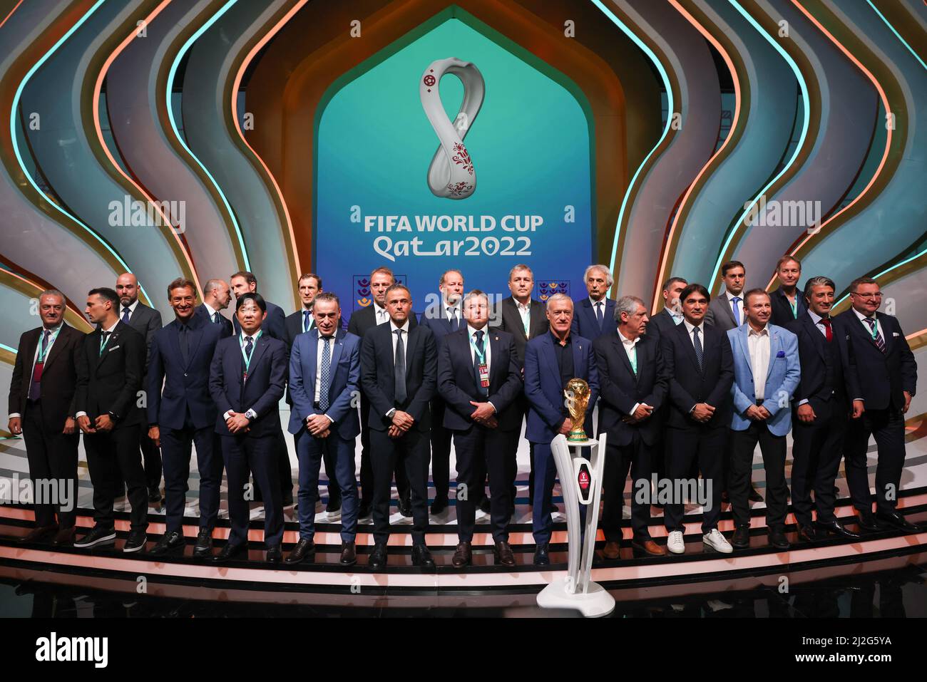 Doha, Qatar. 01st Apr, 2022. Soccer: World Cup, draw for the preliminary round in Doha. The national coaches of the participating teams around Hansi Flick (back row 5th from left), national coach of Germany, stand together after the draw. Credit: Christian Charisius/dpa/Alamy Live News Stock Photo