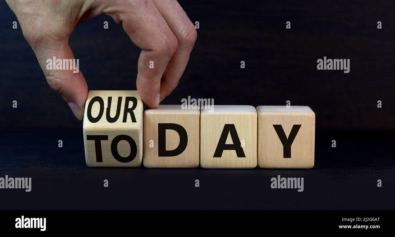 Today is our day symbol businessman turns the wooden cube and changes