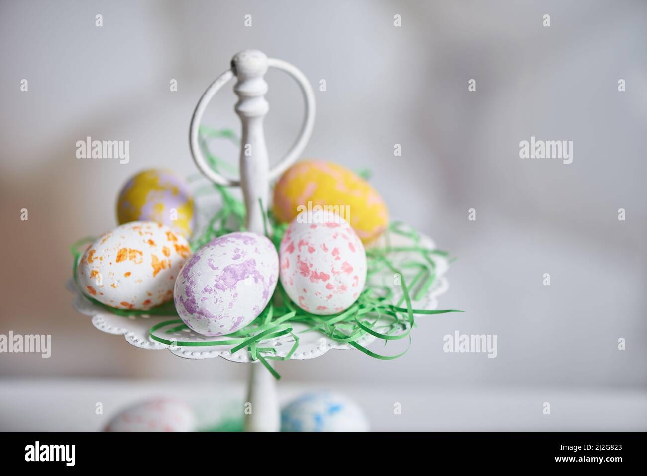 Painted eggs in a plate for the holiday of easter Stock Photo