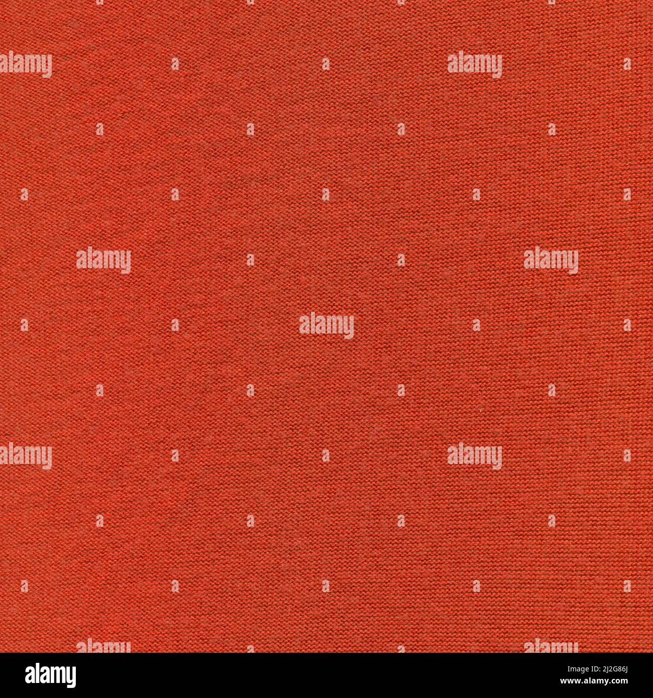 Magneta knitted background with copy space. Fabric poppy red colored colored texture for background and design. Stock Photo