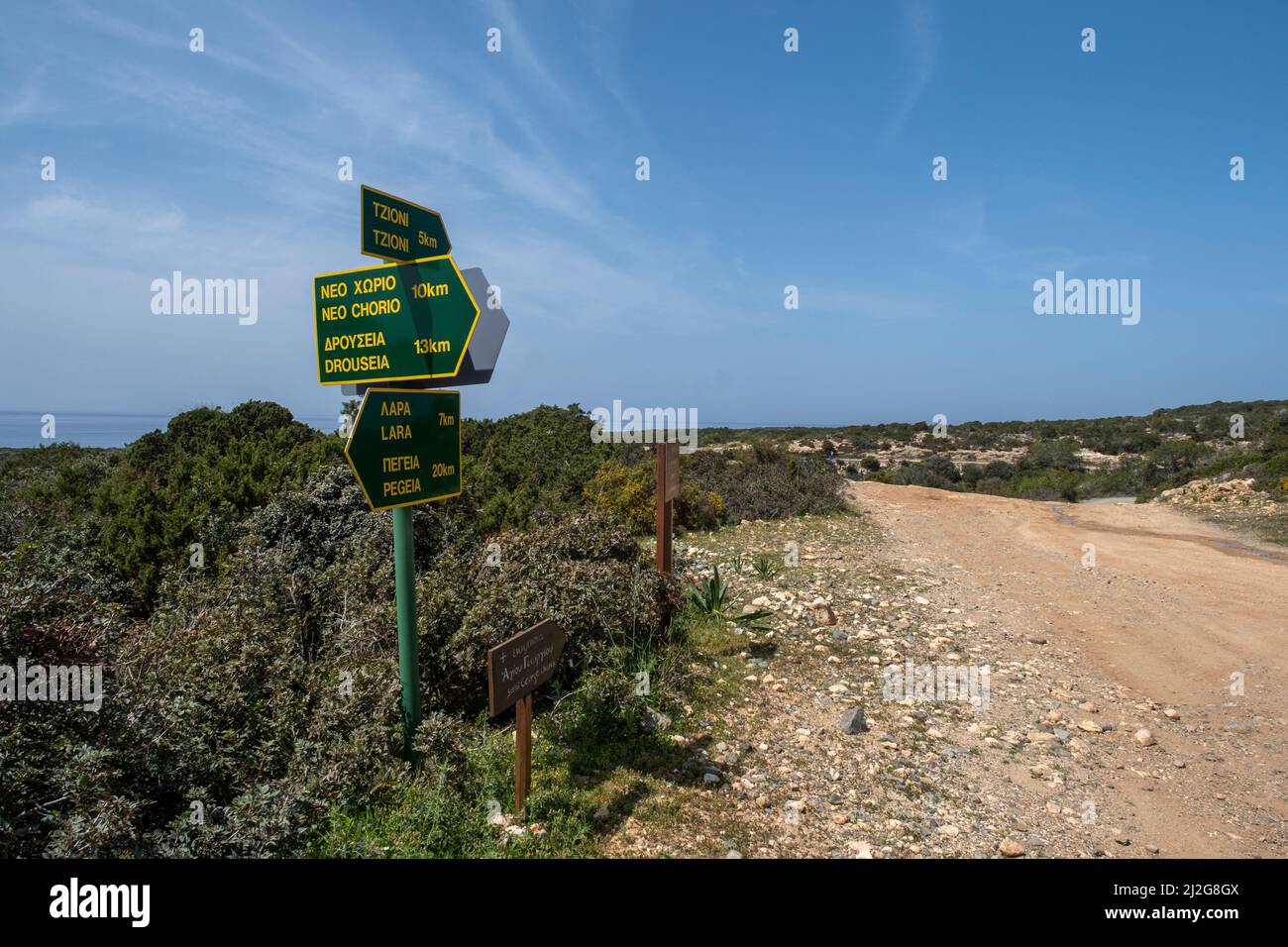 Road sign on the Akamas National Park showing the distance to Neo Chorio and Drouseia, Paphos Region, Cyprus. Stock Photo