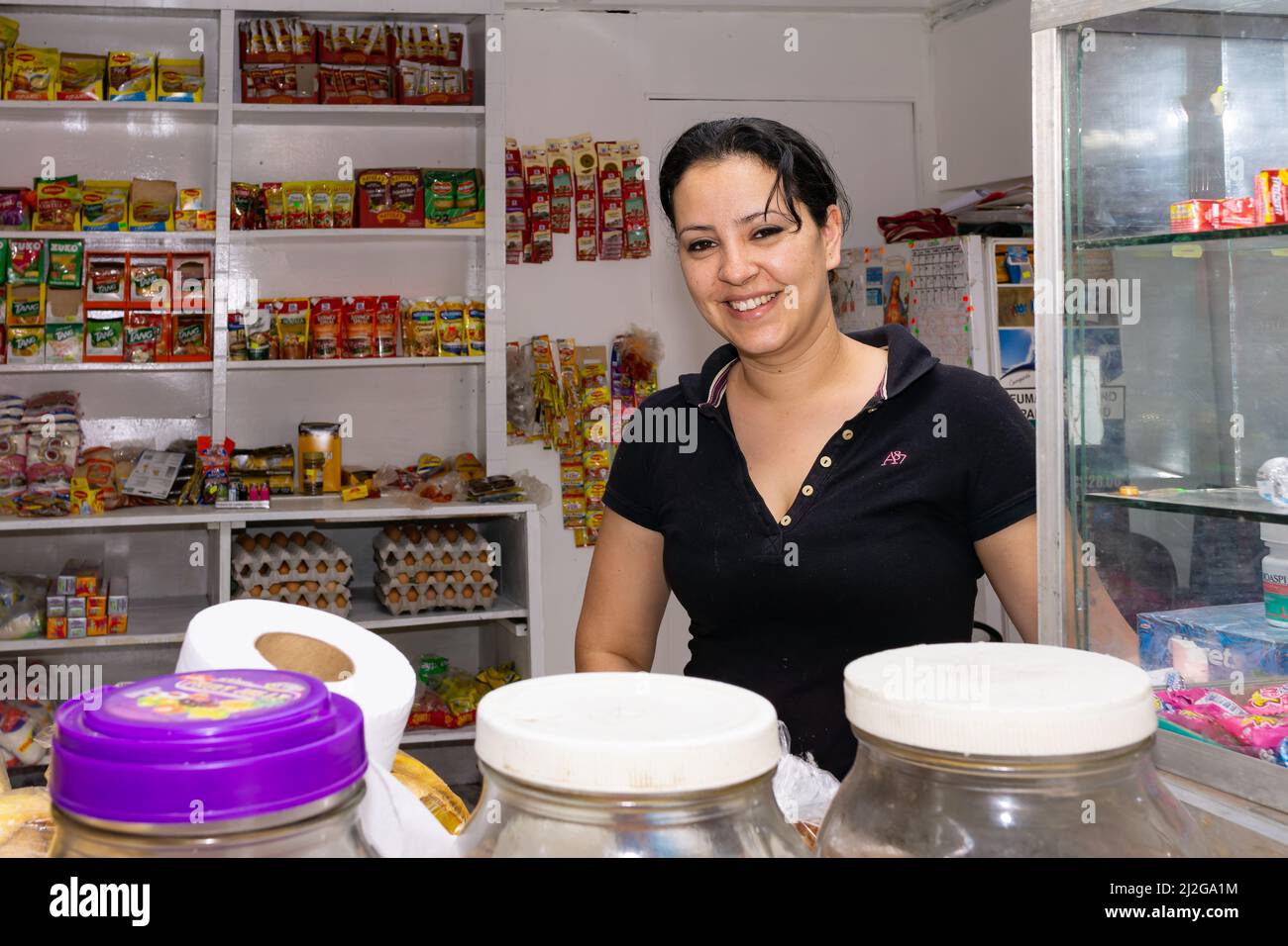 A Nicaraguan woman at her store's counter after a store renovation and expansion. Stock Photo