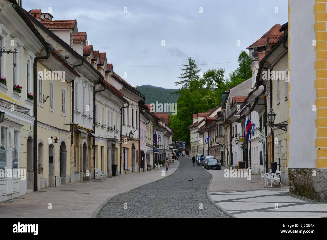 The beautiful houses on the street of Kamnik in the late summer evening ...