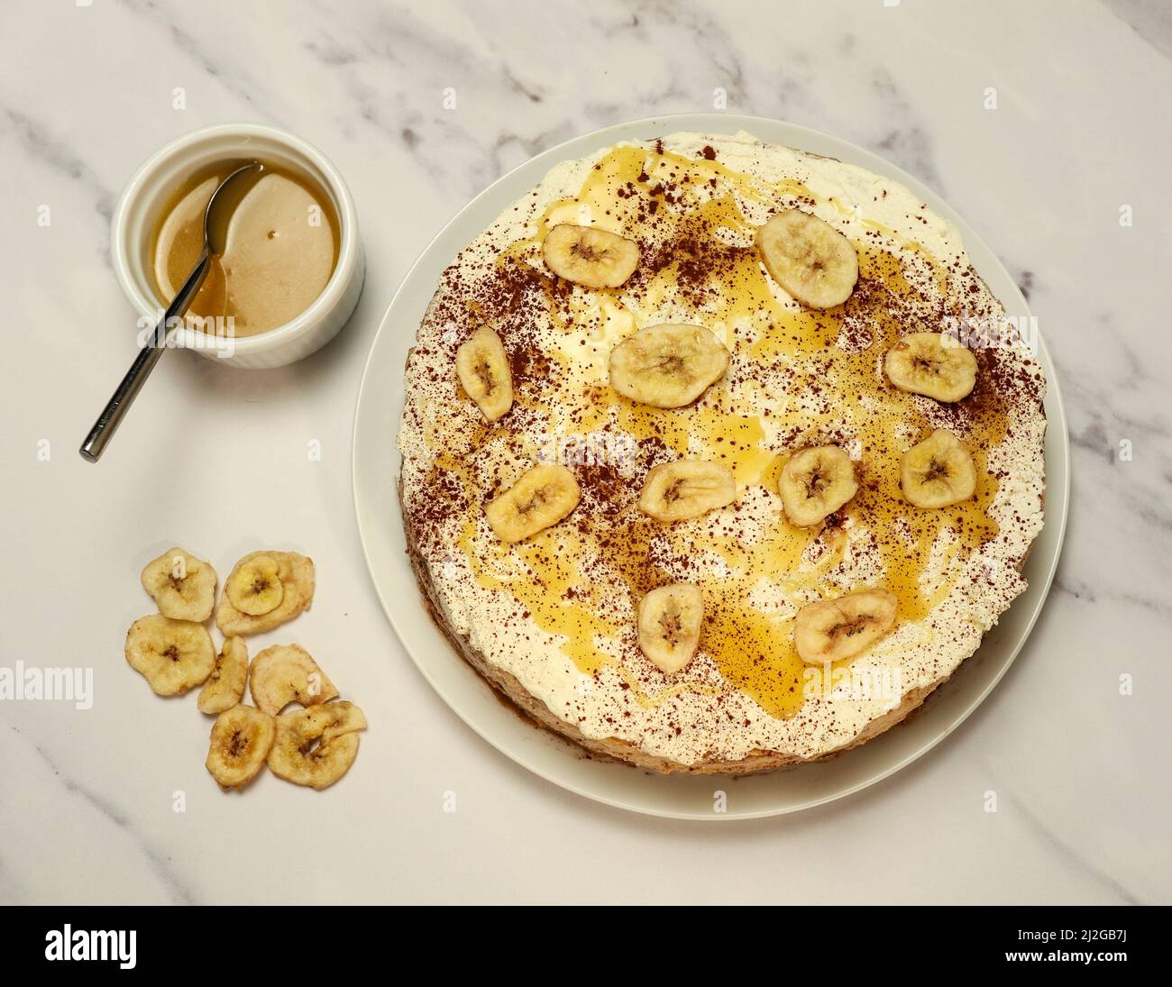 carameldrizzled banoffee bake from above with ingredients Stock Photo