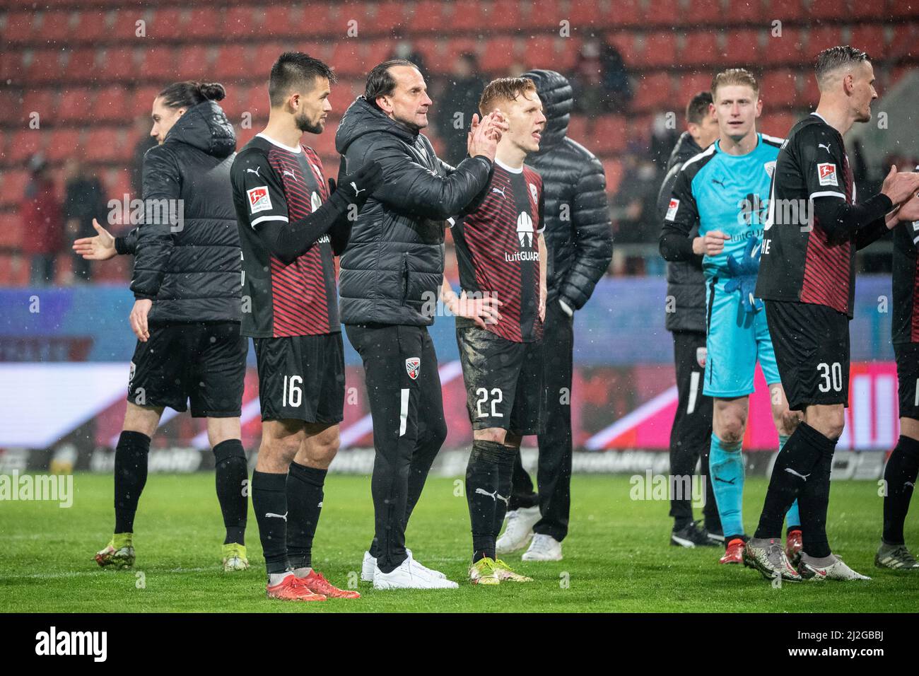 Ingolstadt, Germany. 01st Apr, 2022. Soccer: 2nd Bundesliga, FC Ingolstadt 04 - Erzgebirge Aue, Matchday 28, Audi Sportpark. Ingolstadt coach Rüdiger Rehm (2nd from left) celebrates with fans after the game. Credit: Matthias Balk/dpa - IMPORTANT NOTE: In accordance with the requirements of the DFL Deutsche Fußball Liga and the DFB Deutscher Fußball-Bund, it is prohibited to use or have used photographs taken in the stadium and/or of the match in the form of sequence pictures and/or video-like photo series./dpa/Alamy Live News Stock Photo