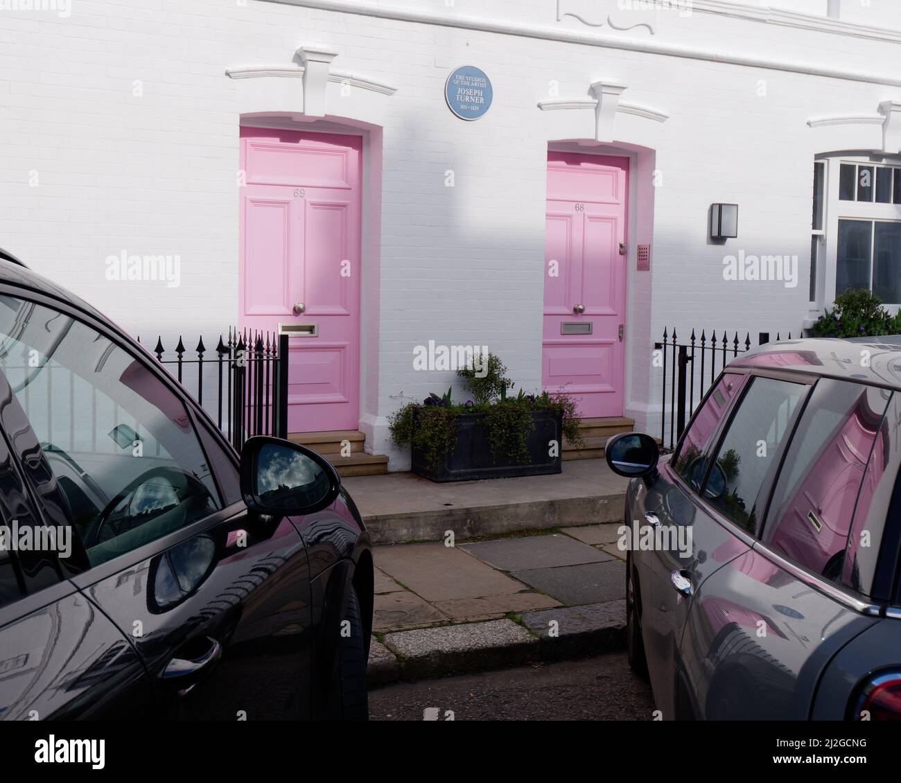 London, Greater London, England,  March 12 2022: Joseph Turner studio with white walls and pink doors just off the Kings Road. Stock Photo