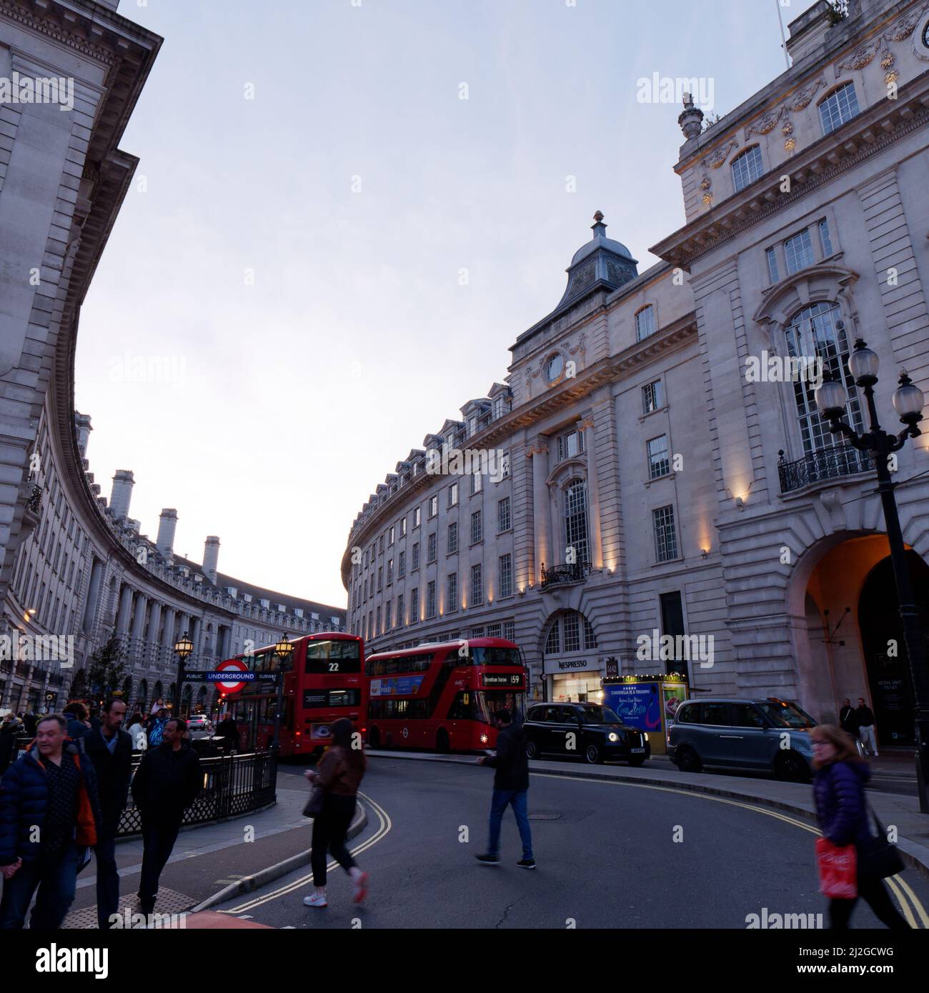 Traffic in Regent Street with pedestrians near Piccadilly Circus tube station, London. Stock Photo