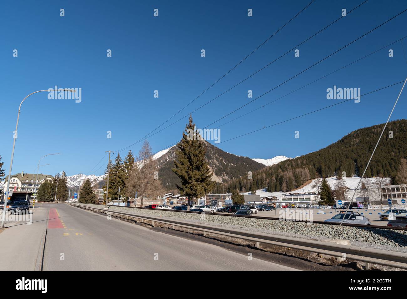 Davos, Switzerland, March 23, 2022 Train track system along a road with
