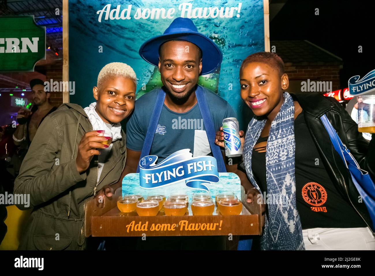 Diverse people having fun at indoor party event in Cape Town, South