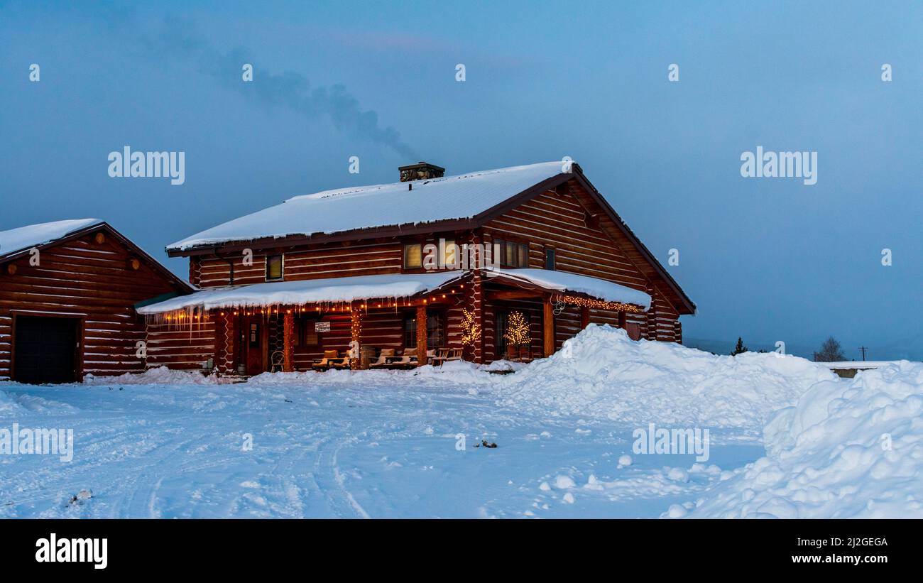 Stanley, ID  USA - 28 Dec 2021: Triangle C Cabins Office Building in the winter Snow Stock Photo