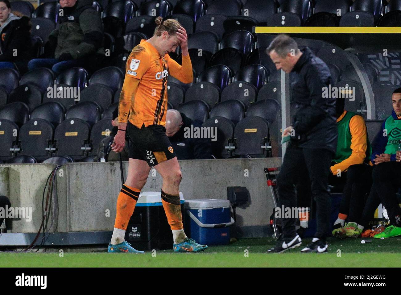 Tom Eaves #9 of Hull City walks off the field with his hand to his head after receiving a second yellow card Stock Photo