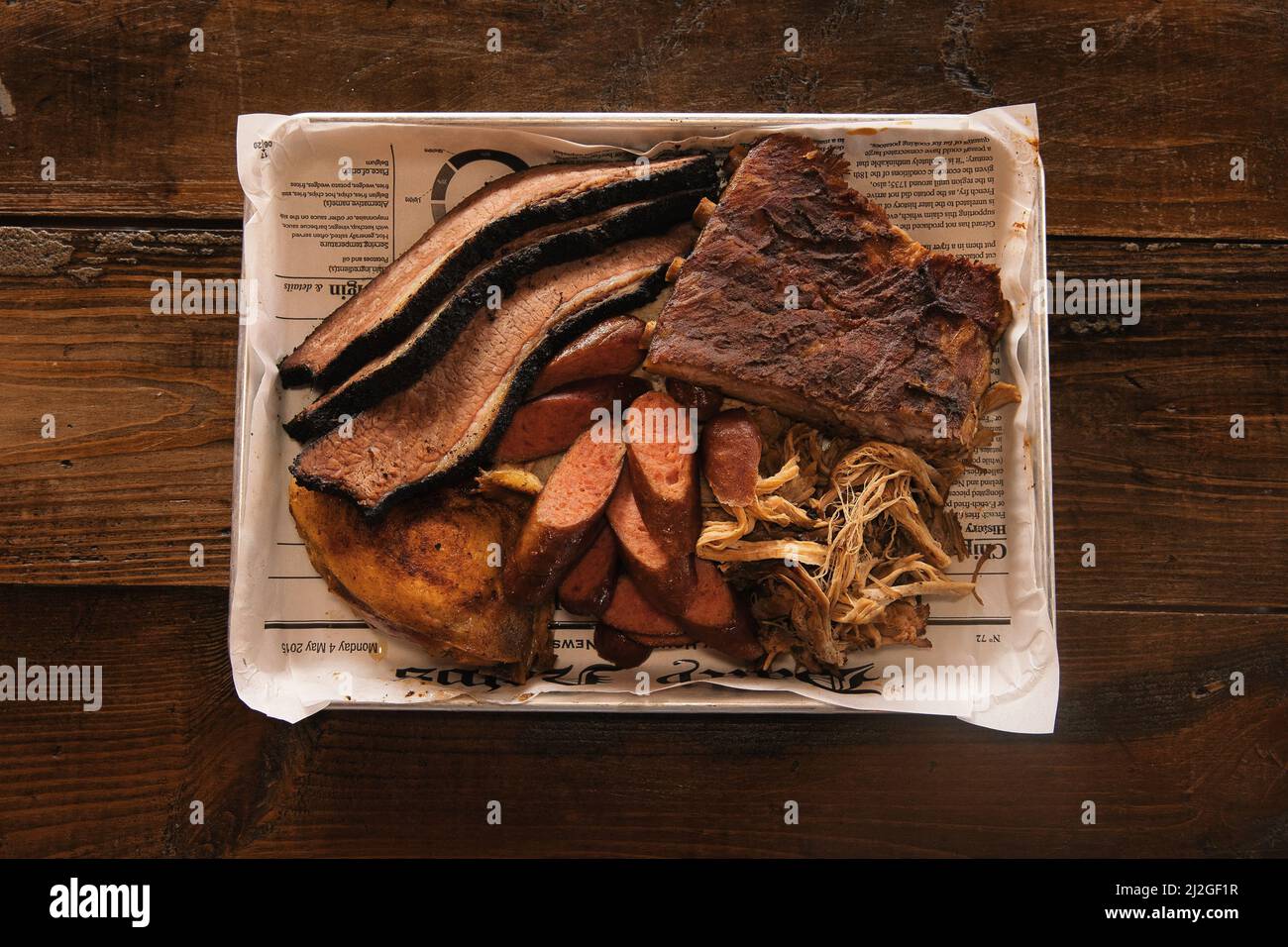 A top view of a meat lovers platter, pulled pork, brisket, and sausage