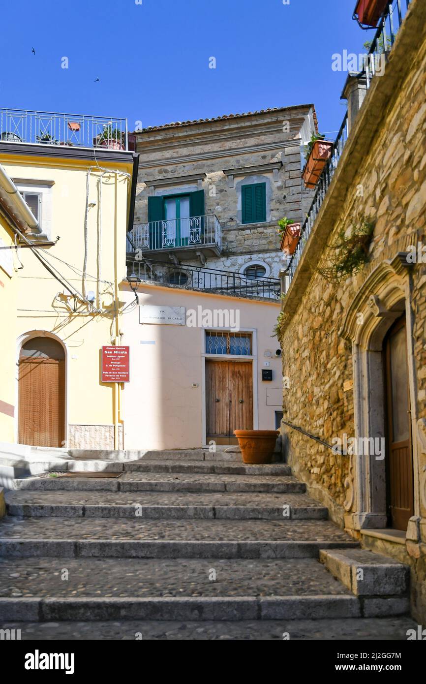 A narrow street between the old houses of Sant'Agata di Puglia, a
